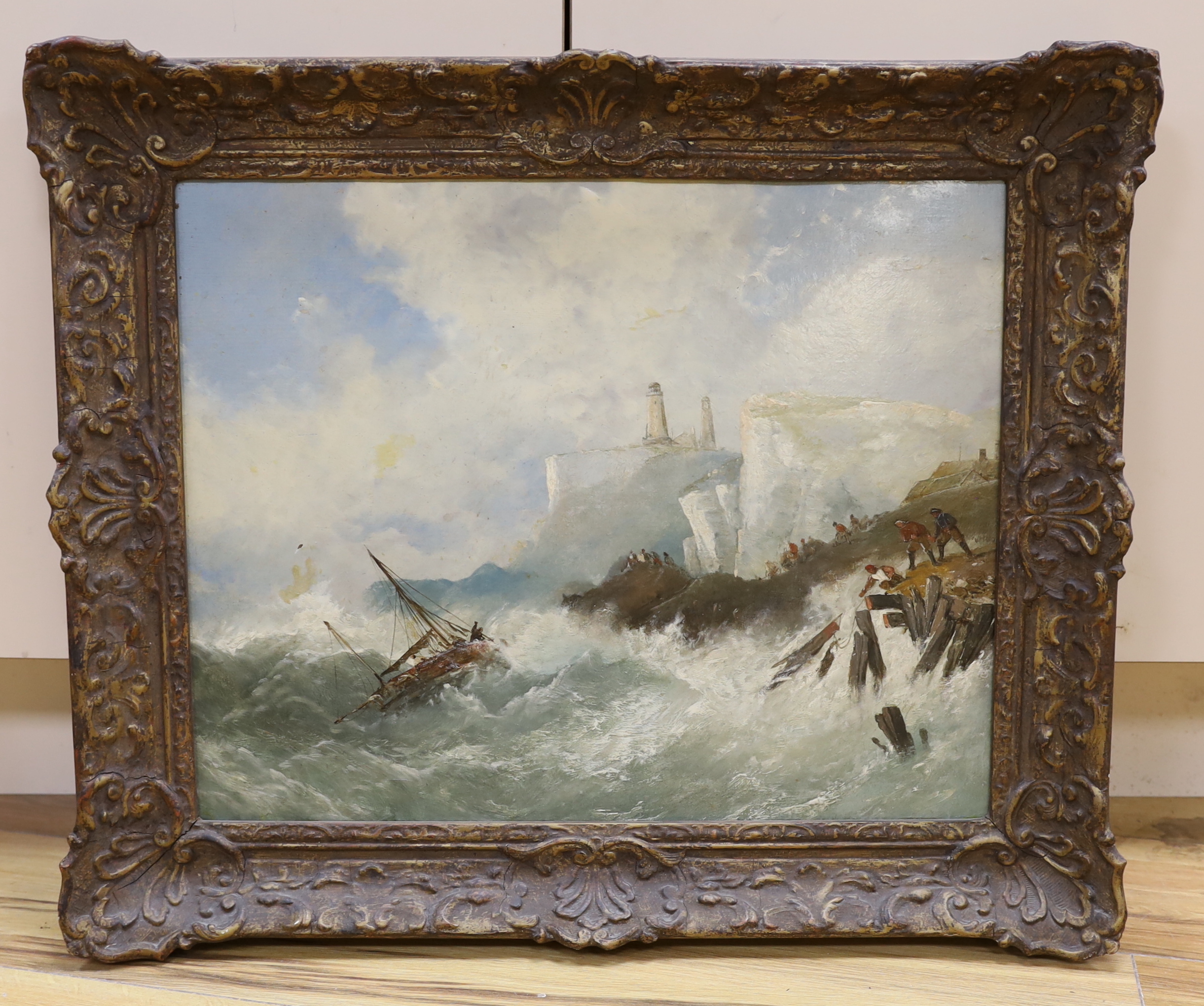 19th century English School, oil on board, Coastal scene with shipwreck before a lighthouse, 39 x 49cm